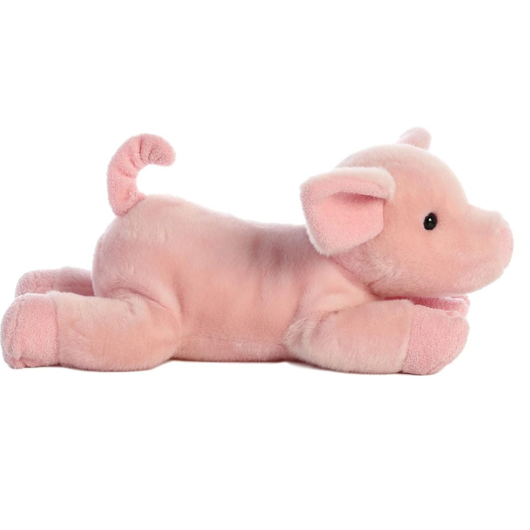 Straight side profile view of the Pickles Piglet plush showing its floppy front legs, pastel pink body, and signature curly tail.