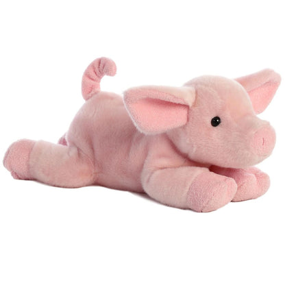 Angled side view of the Aurora Flopsie Pickles Piglet 12-inch plush resting on its belly, featuring soft pink fur, floppy ears, and a curly tail.