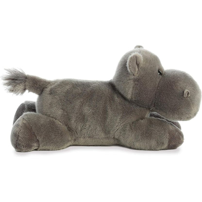 Side profile view of the gray hippo stuffed animal showing its lounging posture, short legs, and small tufted tail.
