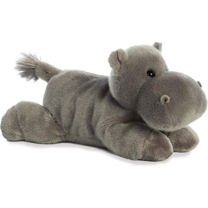 Angled front view of the Aurora Flopsie Howie Hippo 12-inch plush resting on its belly, featuring soft gray fur and a large snout.