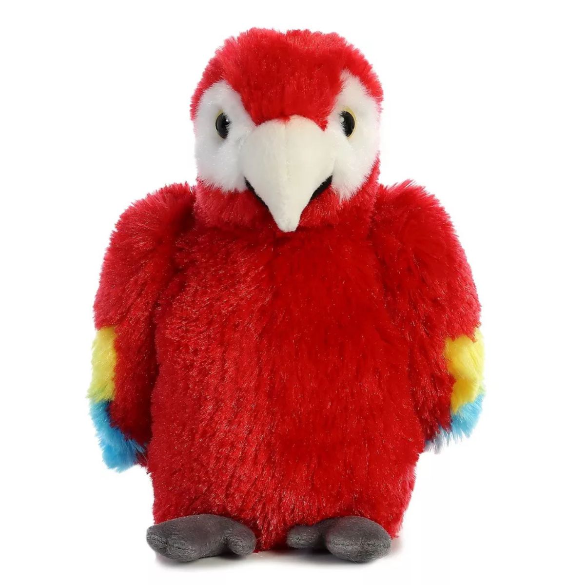 Straight front view of the Scarlet Macaw plush resting flat on its belly, showing its white face and curved beak.
