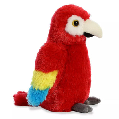 Side profile view of the macaw stuffed animal highlighting its layered blue and yellow wings.