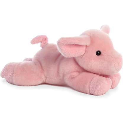 Side view of the Aurora Mini Flopsie Pickles the Piglet 8-inch plush resting on its belly, featuring soft pink fur and a curly tail.