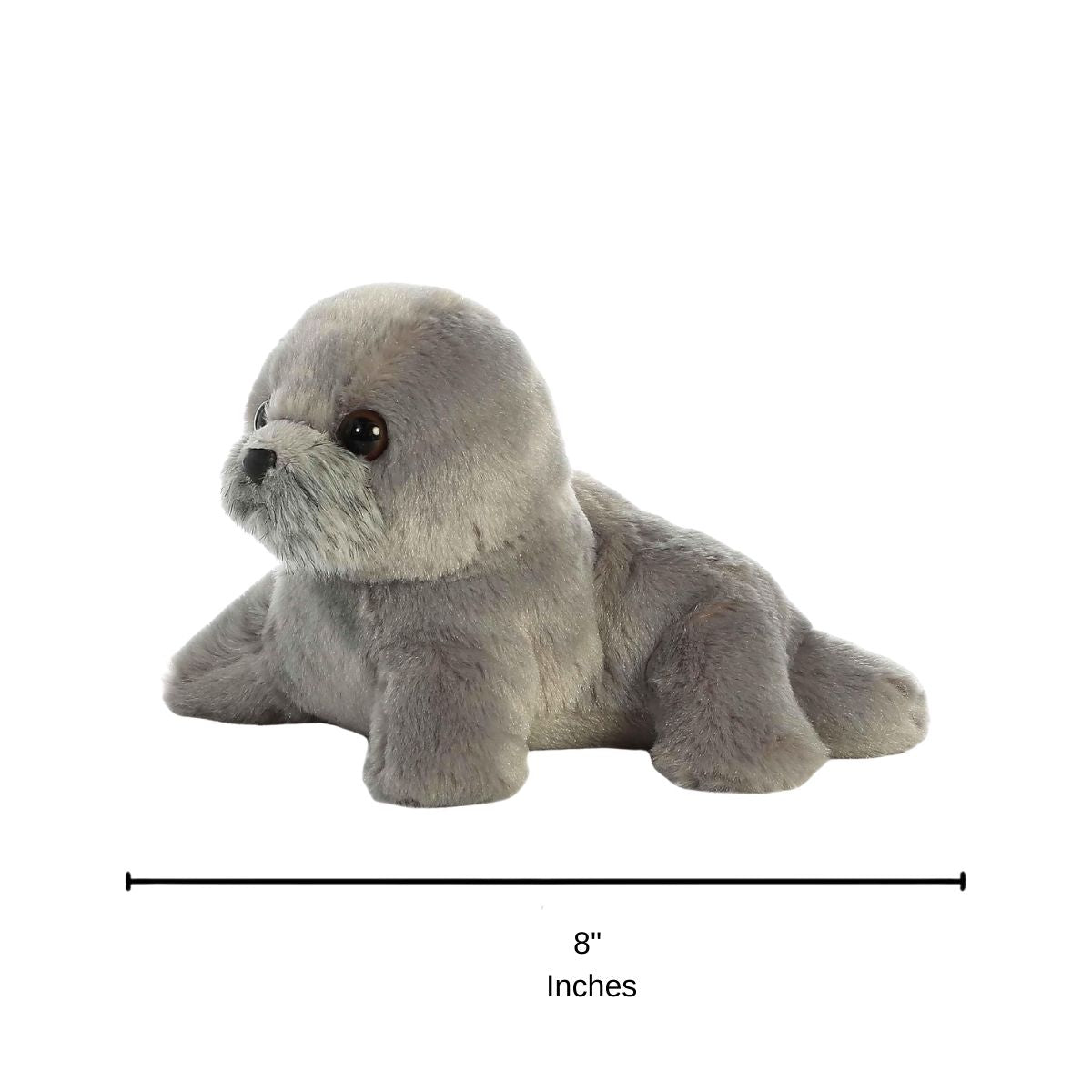 Angled side profile view of the Harpo Seal plush resting on its tummy with a measurement graphic indicating it is 8 inches long.