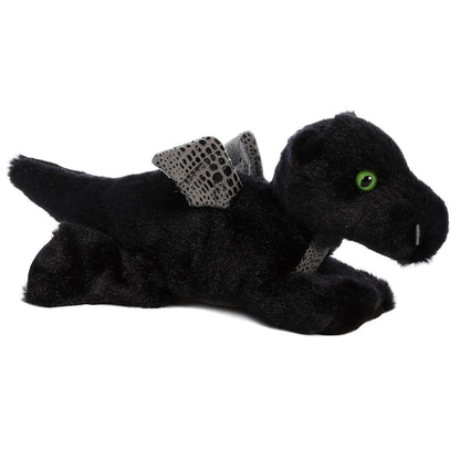 Angled front view of the Aurora Mini Flopsie Midnight Dragon 8-inch plush resting on its belly, featuring black fur, silver wings, and green eyes.