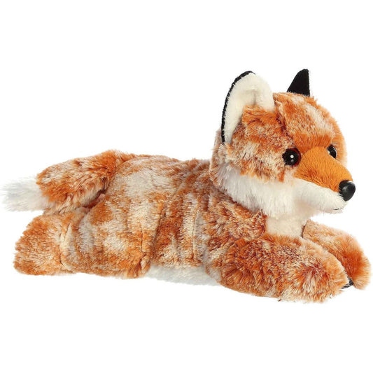Angled view of the Aurora Flopsie 8-inch Autumn Fox plush laying down, showing its mottled reddish-brown fur, black-tipped ears, and white accents.