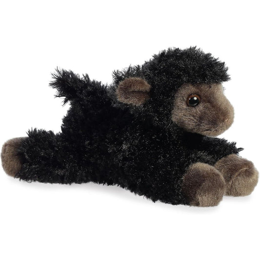 Angled front view of the 8-inch Aurora Mini Flopsie Ebony the Lamb plush toy laying down, featuring fluffy black fleece and a dark grey-brown face.