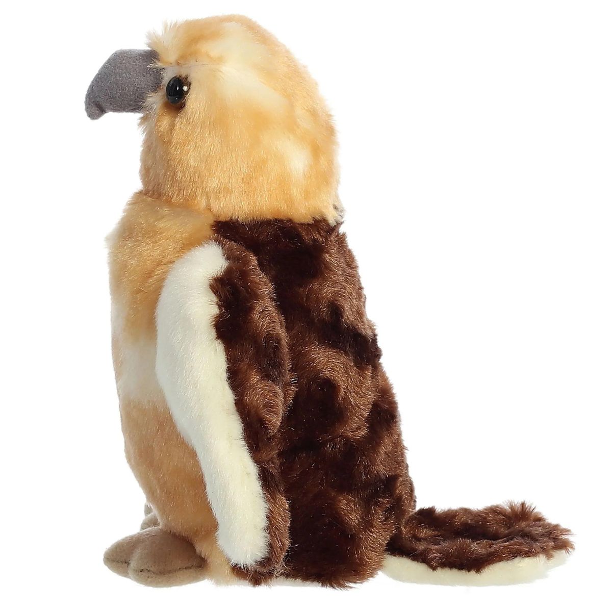 Side profile view of the Aurora Hawk plush showing its grey beak and the beautiful contrast between its tan chest and dark brown wings.