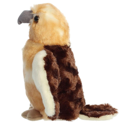 Side profile view of the Aurora Hawk plush showing its grey beak and the beautiful contrast between its tan chest and dark brown wings.