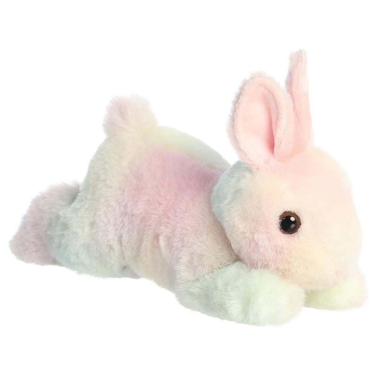 Angled side view of the Aurora Flopsie 8-inch Spring Time Pastel Bunny plush laying down, showing its colorful tie-dye fur and pink inner ears.