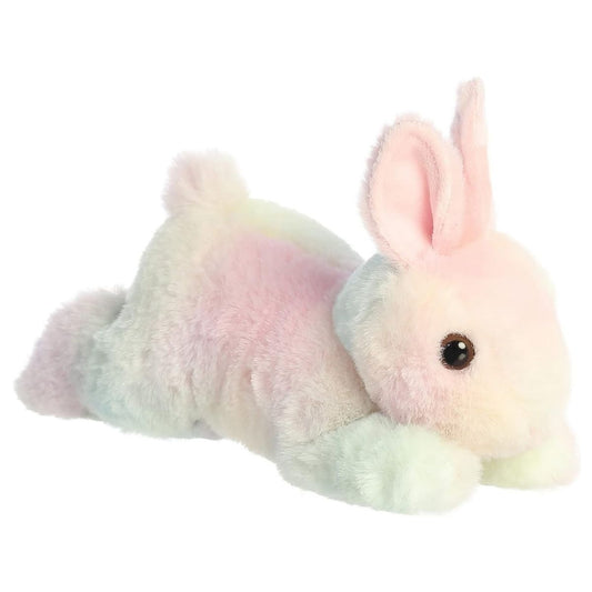 Angled side view of the Aurora Flopsie 8-inch Spring Time Pastel Bunny plush laying down, showing its colorful tie-dye fur and pink inner ears.