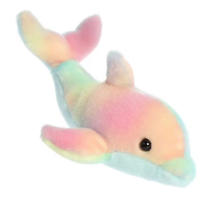 Angled side profile view of the 8-inch Aurora Mini Flopsie Rainbow Dolphin plush resting on its belly.