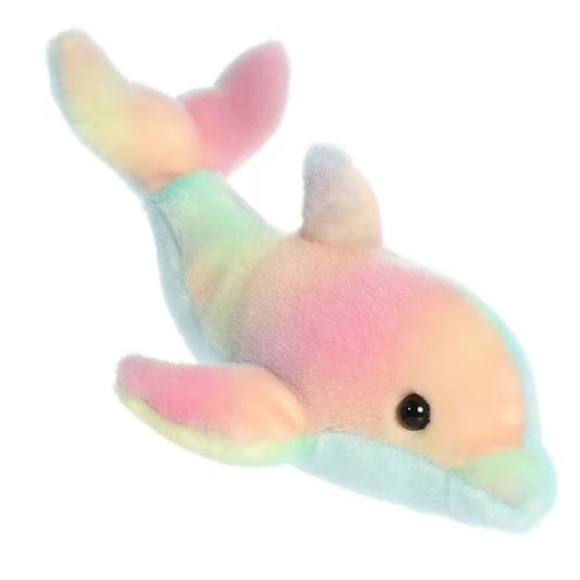 Angled side profile view of the 8-inch Aurora Mini Flopsie Rainbow Dolphin plush resting on its belly.