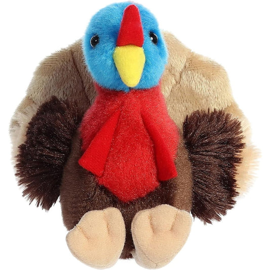 Straight front view of the Thomas Turkey stuffed animal highlighting his yellow beak, bright blue head, and fluffy brown wings.