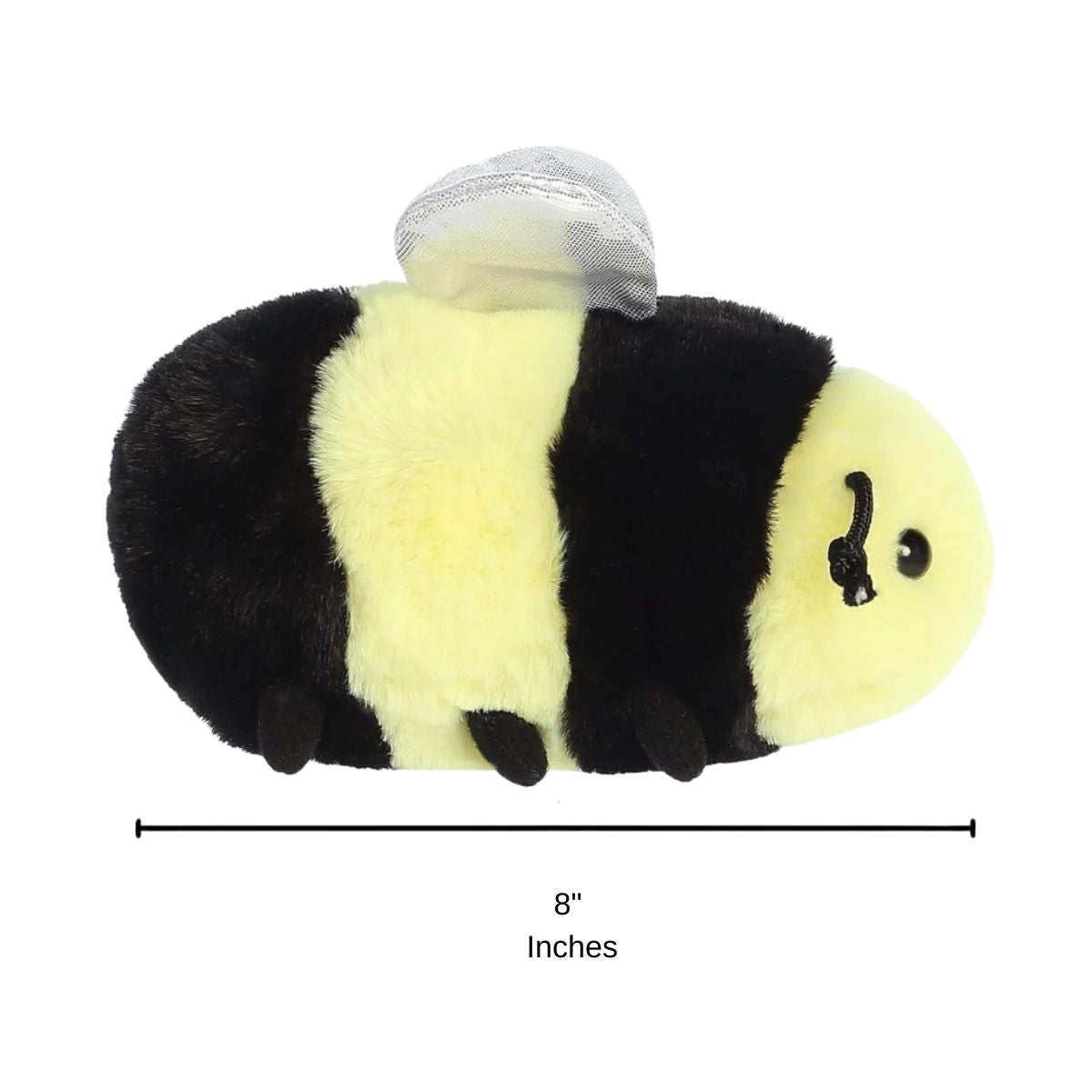 Side profile view of the Beeswax Bee plush resting on its tummy with a measurement graphic indicating it is 8 inches long.