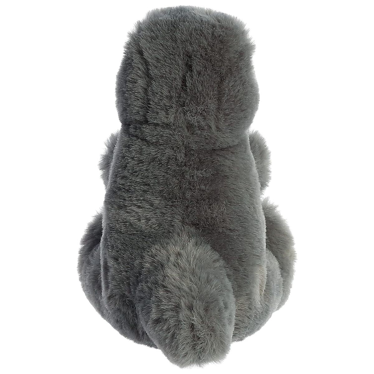 Back view of the Aurora dinosaur plush showcasing its soft grey back and thick tail.
