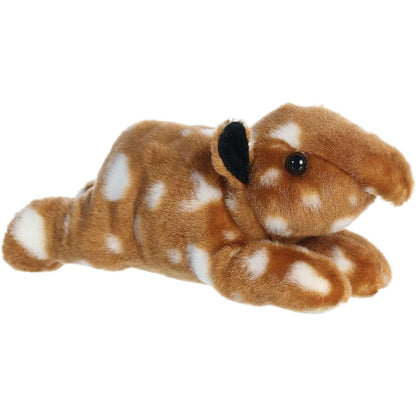Angled view of the Aurora Mini Flopsie 8-inch Tapir Calf plush resting on its belly, showing its brown fur with white spots and stripes.