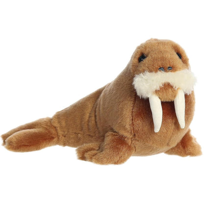Angled front view of the 8-inch Aurora Mini Flopsie Wallace Walrus stuffed animal lying down with its white tusks visible.