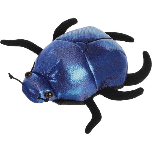 Angled top view of the Aurora Mini Flopsie Saqqara Scarab Beetle 8-inch plush featuring a shimmering metallic blue body and soft black legs.