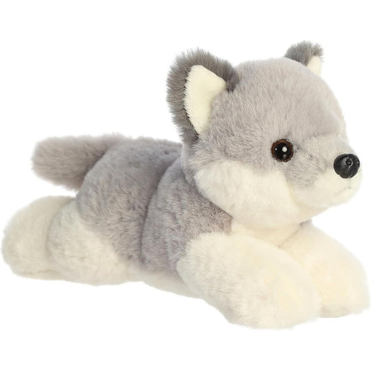 Angled front view of the 8-inch Aurora Mini Flopsie Wolf Pup stuffed animal lying down, showing its grey and white fur.