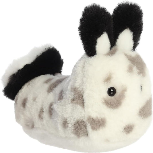 Angled front view of the 6-inch Aurora Mini Flopsie Serene Sea Bunny stuffed animal showing its spotted body and black ears.