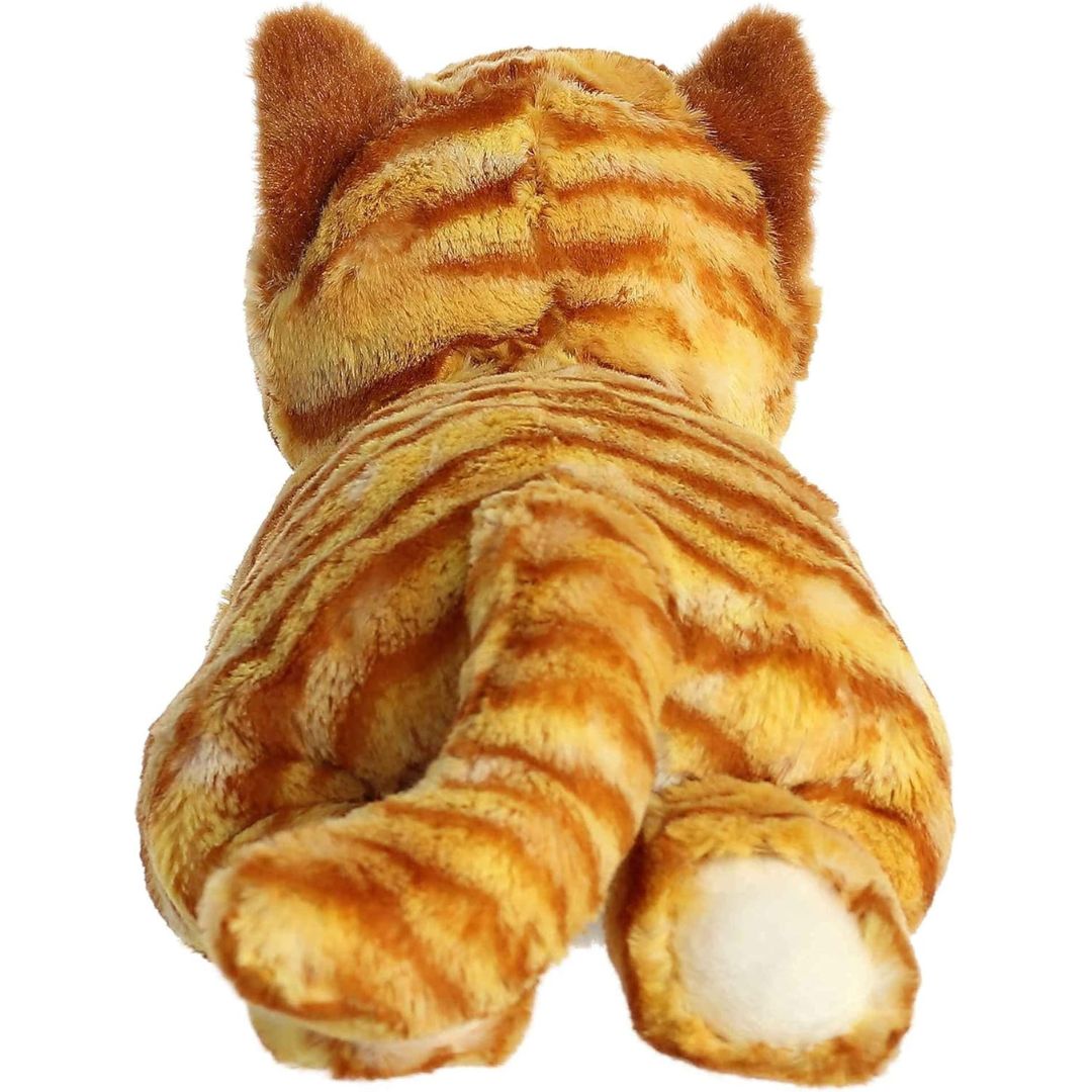 Direct back view of the orange cat plush highlighting its striped tail and the white bottoms of its hind paws.