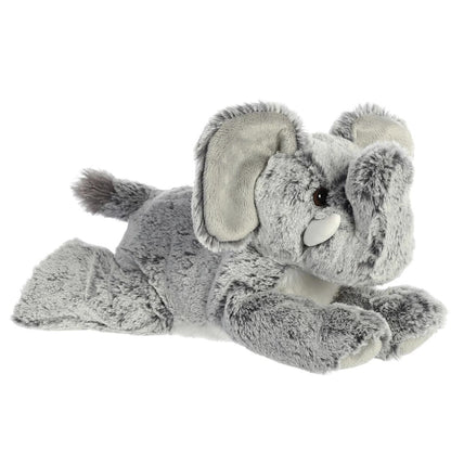 Angled front view of the Aurora Flopsie Leroy the Elephant 12-inch plush resting on its belly, featuring textured gray fur and a raised trunk.
