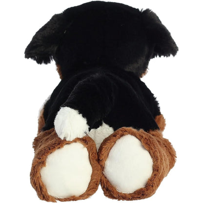 Direct back view of the dog plush highlighting his white-tipped tail and the white bottoms of his hind paws.