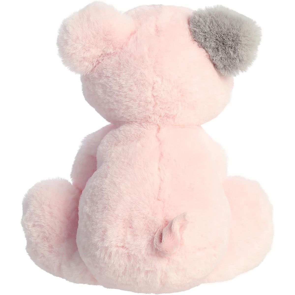 Rear view of the pig plush showing its grey ear patch, pink back, and cute curly tail.