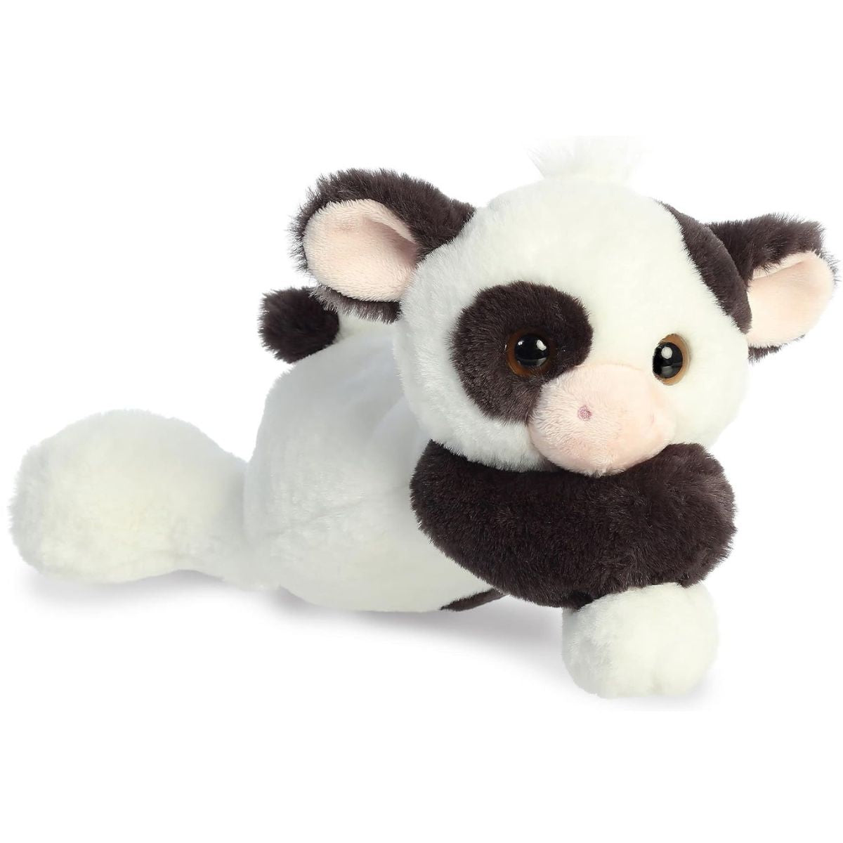 Side view of the Aurora Flopsie Bessie Cow resting on its belly, showing its floppy, bean-filled body.