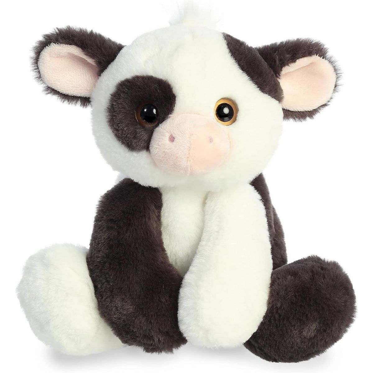 Straight-on front view of the Aurora Flopsie Bessie Cow 12-inch plush sitting upright, featuring black and white spots and amber eyes.