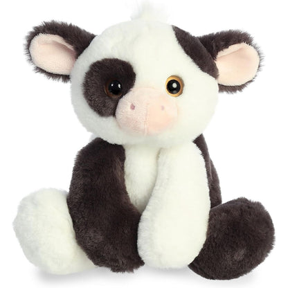 Straight-on front view of the Aurora Flopsie Bessie Cow 12-inch plush sitting upright, featuring black and white spots and amber eyes.