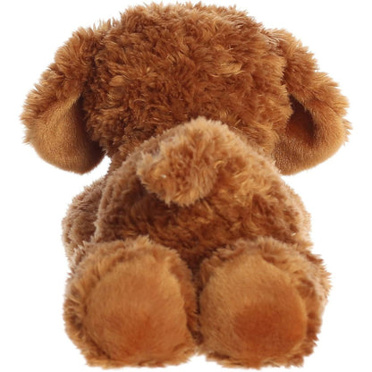 Back view of the cuddly Flopsie dog stuffed animal showing its textured brown back, little tail, and hind paws.