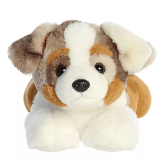 Close-up front view of the Aurora Arlo Australian Shepherd plush puppy showing its sweet face, floppy ears, and white front paws.