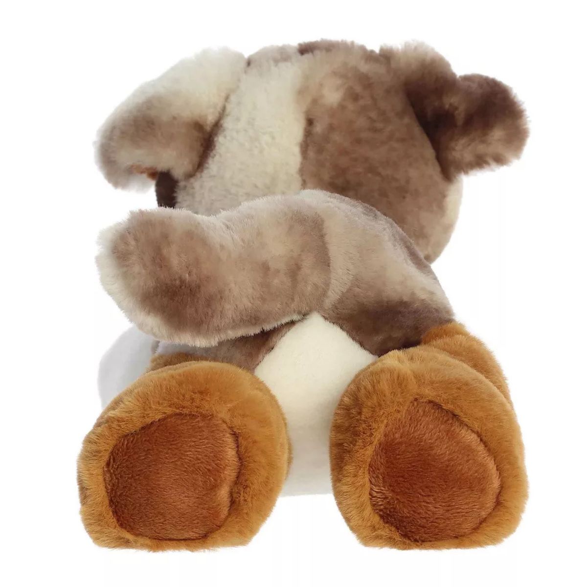 The back of the Aurora Flopsie Australian Shepherd plush toy displaying its brown rear paws and extended fluffy tail.