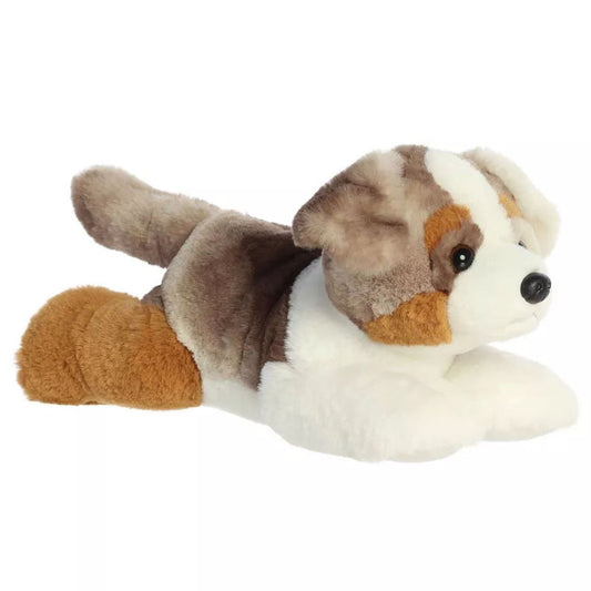 Aurora Flopsie Arlo 12-inch Australian Shepherd plush stuffed dog laying down in a three-quarter profile view against a white background.