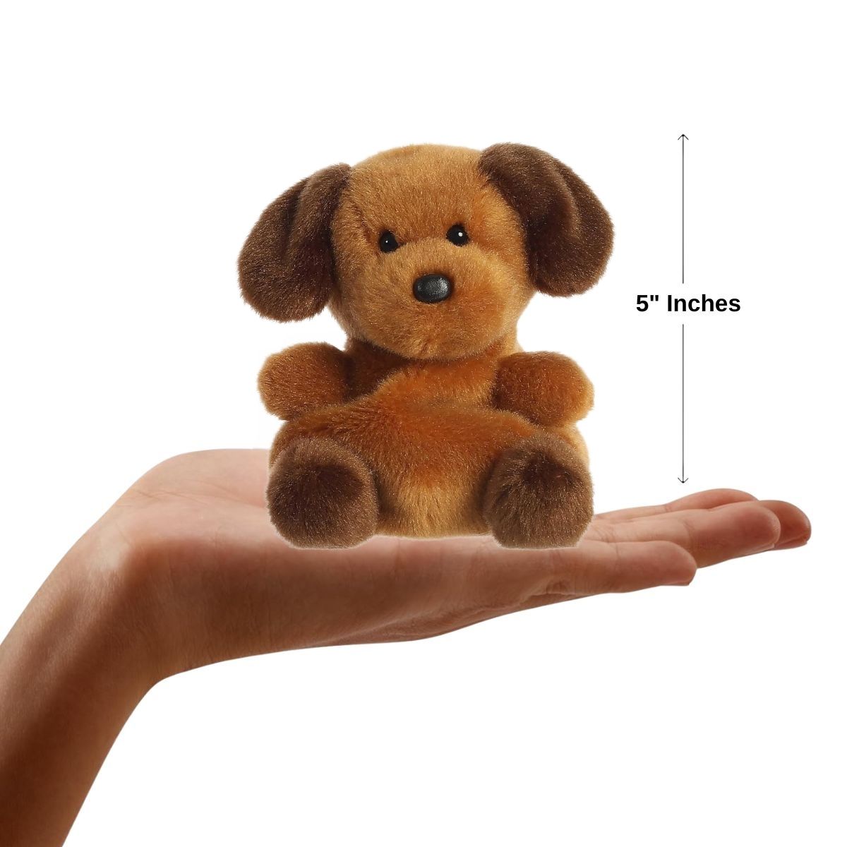 Sizing graphic showing the 5-inch Palm Pals Ruff Ruff Puppy sitting perfectly in the palm of a person's hand to demonstrate its miniature scale.