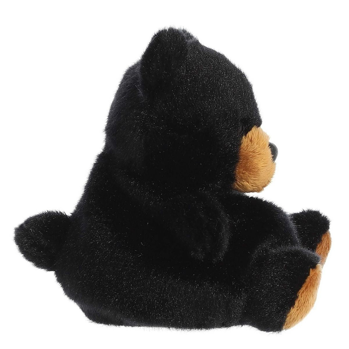 Angled side and back view of the Aurora Palm Pals Sleepy Black Bear plush highlighting its round body and little tail.