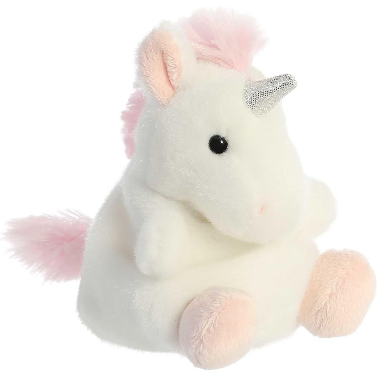 Aurora 5-inch Palm Pals Sassy Unicorn plush toy sitting at an angle showing its clean white fur, fluffy pink mane and tail, and a sparkling silver horn.