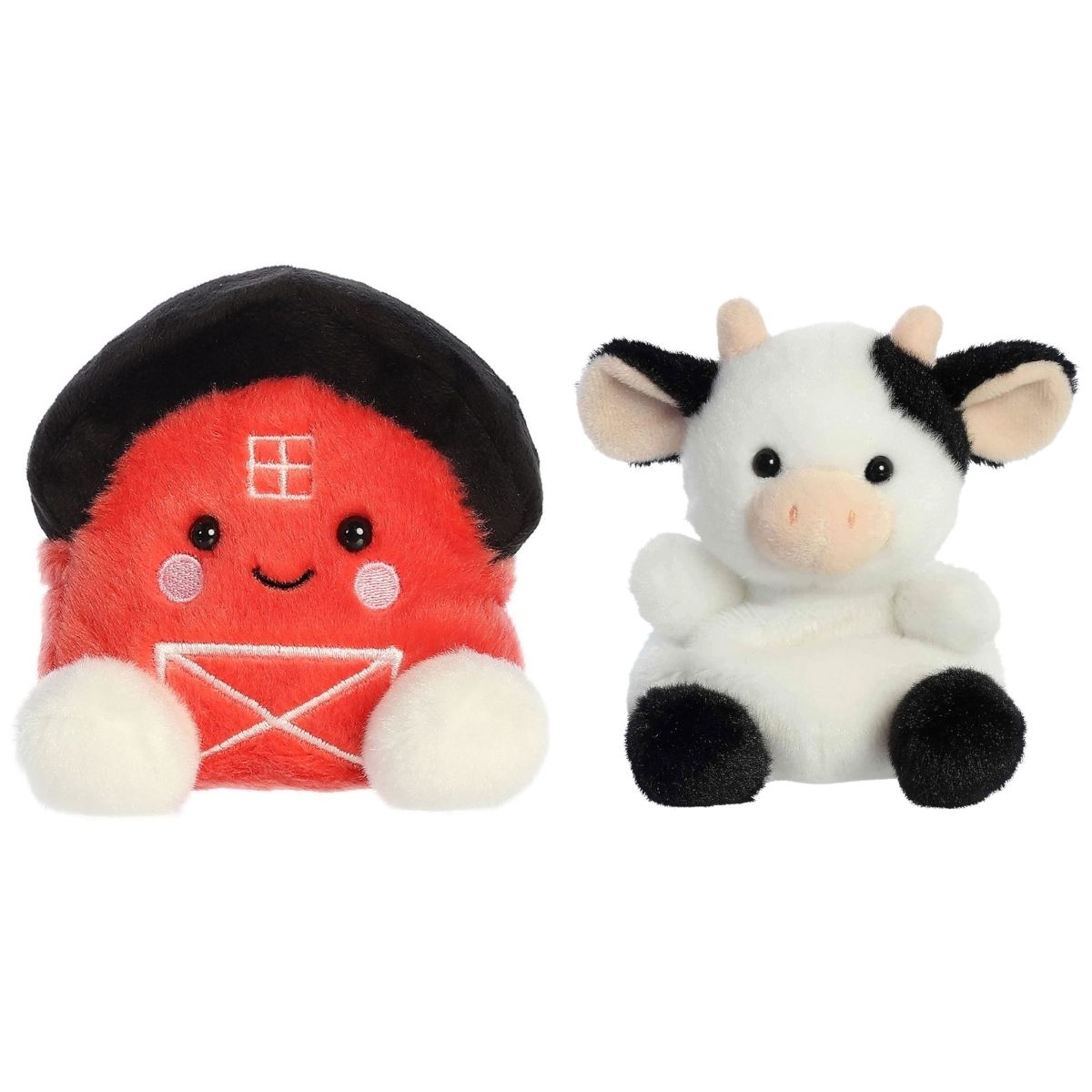 Close-up front view of the smiling red Palm Pals Oakley Barn and black and white Sweetie Cow plush toys.