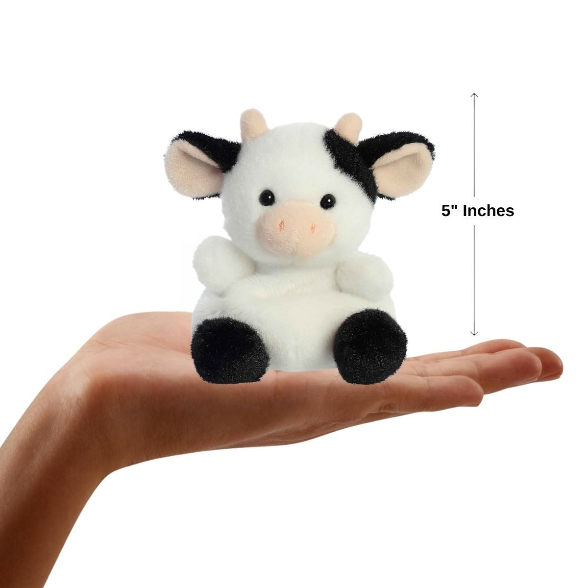 Dimension graphic showing the 5-inch Aurora Palm Pals Sweetie Cow resting comfortably in a person's hand.