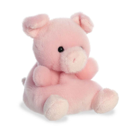 Aurora 5-inch Palm Pals Wizard Pig plush toy sitting at an angle showing its soft pastel pink fur, prominent snout, and folded floppy ears.