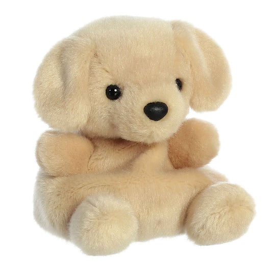 Aurora 5-inch Palm Pals Sunny Lab Labrador plush toy sitting at an angle showing its creamy golden-tan fur, floppy puppy ears, and gentle black safety eyes.