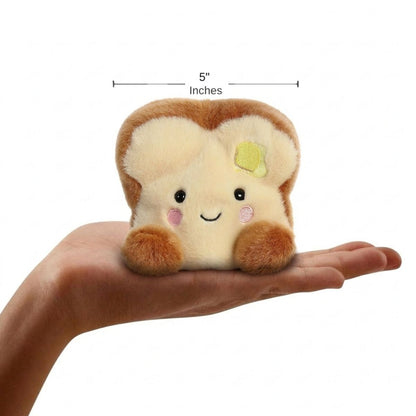 The miniature Buttery Toast plush sitting balanced in an open human hand under a 5-inch height graphic indicator.
