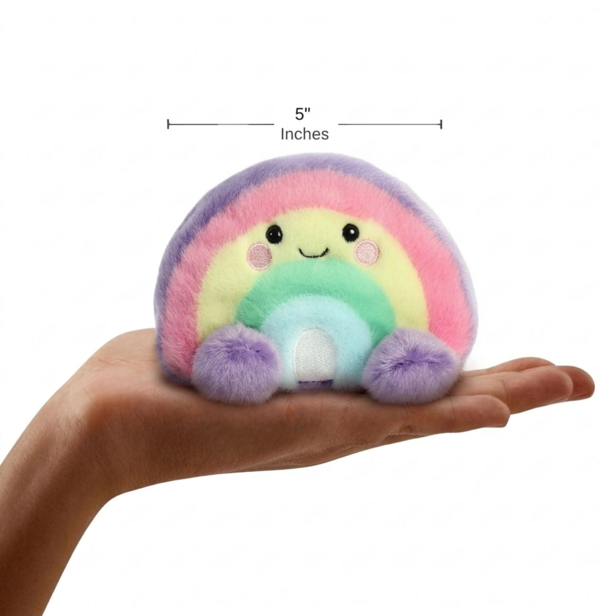 Lifestyle sizing graphic showing the 5-inch Aurora Palm Pals Vivi Rainbow plush sitting perfectly in the palm of a person's outstretched hand.