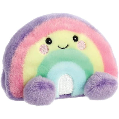 Front angled view of the Aurora Palm Pals 5-inch Vivi Rainbow plush sitting upright with pastel colors and a sweet smiling face.