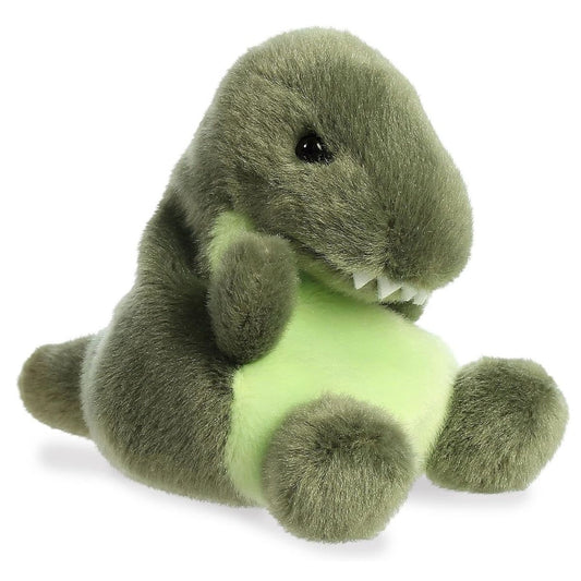 Angled view of the Aurora Palm Pals 5-inch Tyranno Rex T-Rex Dinosaur plush sitting upright, showing its dark green body, light green belly, and tiny arms.