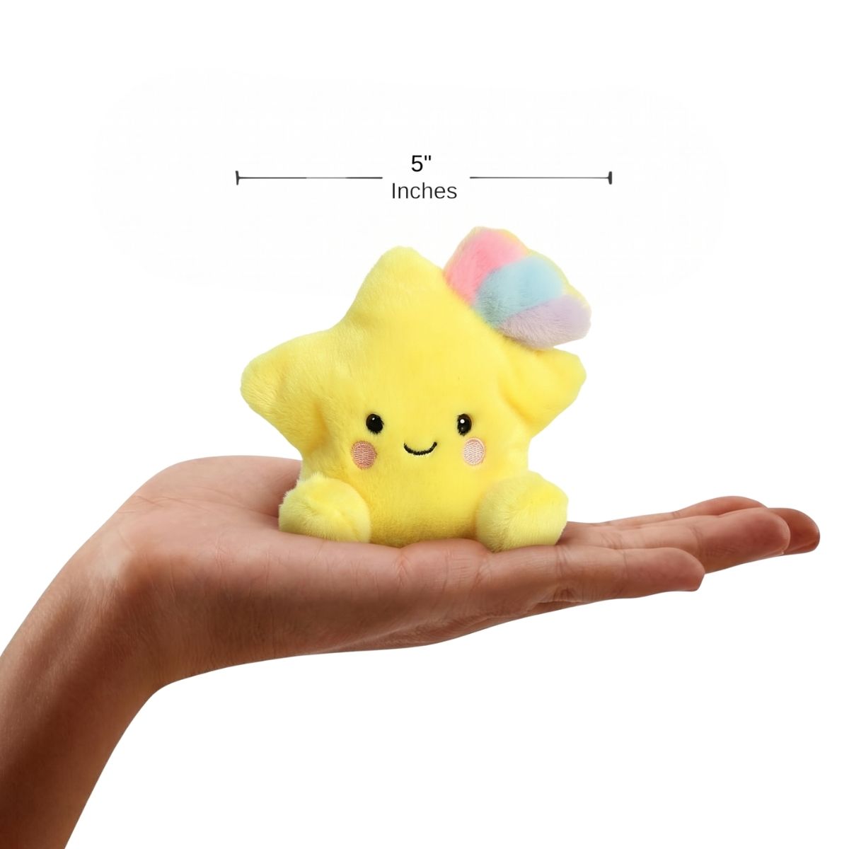 The miniature Pisces Shooting Star plush sitting balanced in an open human hand under a 5-inch height graphic indicator.