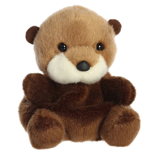 Aurora 5-inch Palm Pals Selena Sea Otter plush toy showing its dark brown body, golden-tan head, prominent fluffy cream muzzle, and small black button nose.