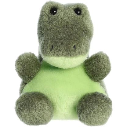 Aurora 5-inch Palm Pals Scales Alligator plush toy sitting forward showing its olive-green body, light lime-green chest, and glossy black eyes.